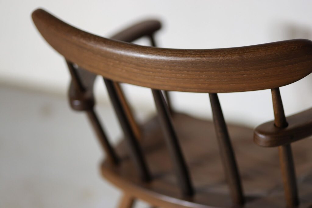 Bog oak custom curved back chair by Brownell Furniture.